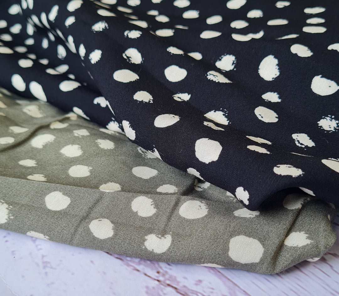 Random dots 100% Viscose Challis dress fabric by the half metre. Navy/green/black.