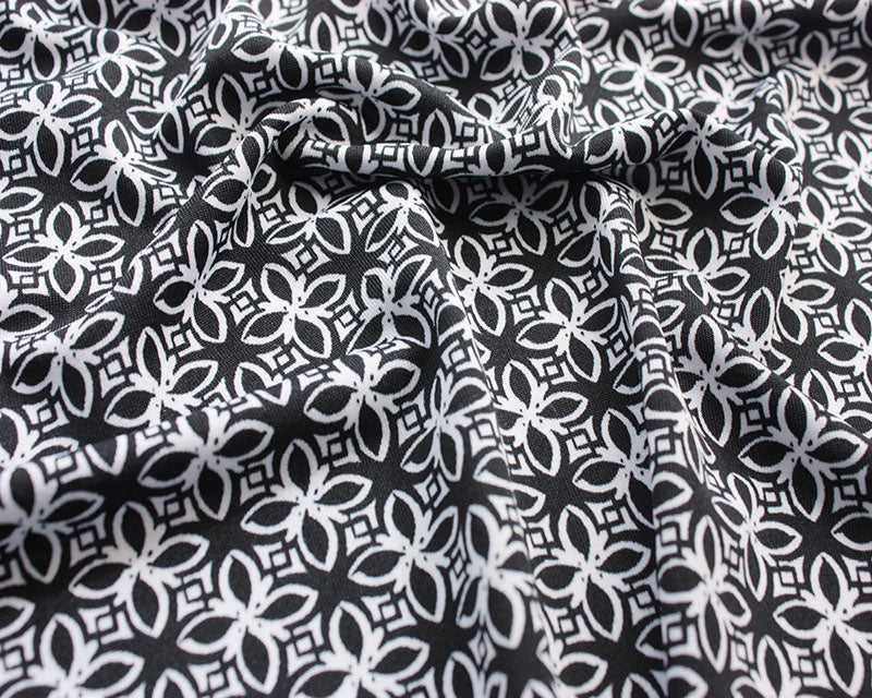 Monochrome Flower Tiles stretch jersey knit fabric. Cut to order in .5 m increments.