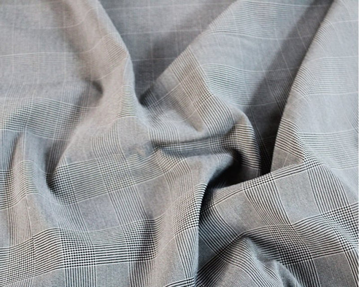 Micro Check Stretch Suiting. 2% elastane, polyester and viscose. Sold by the half metre