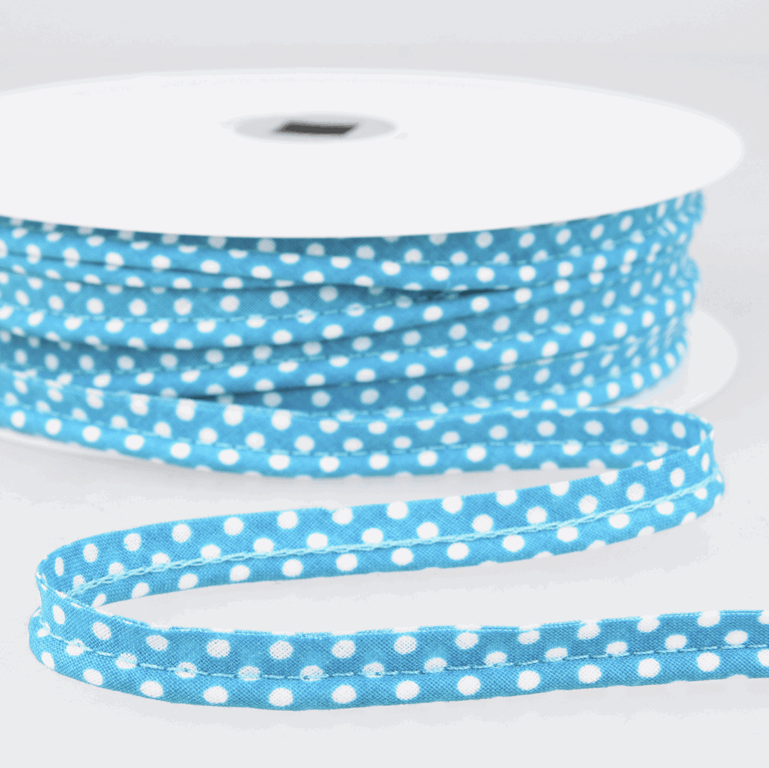 Patterned flanged 10mm wide piping cord trim 2 mm. Floral and polkadot trim. Per Metre